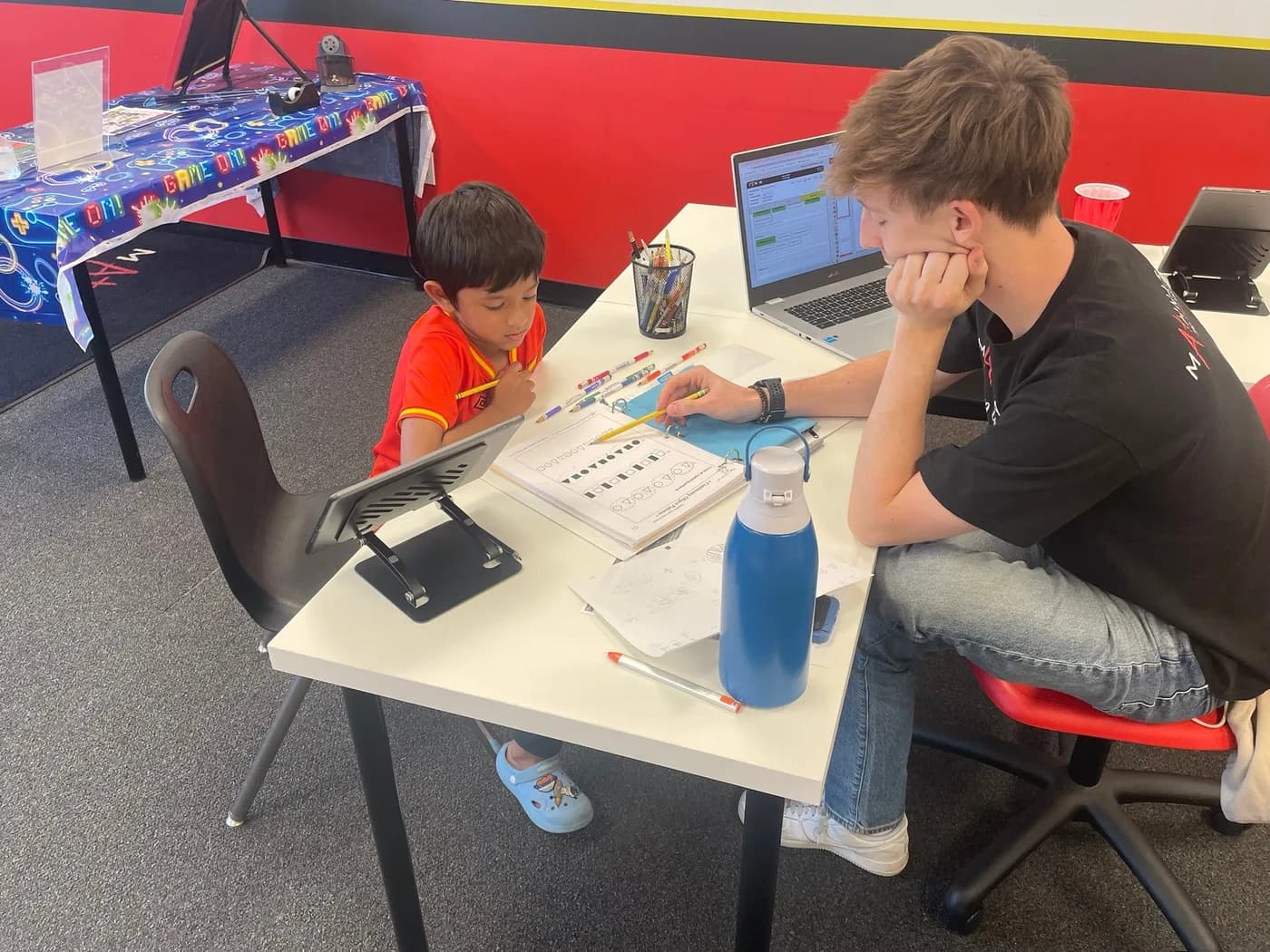 A student and instructor working together at a table at Mathnasium of Westmere
